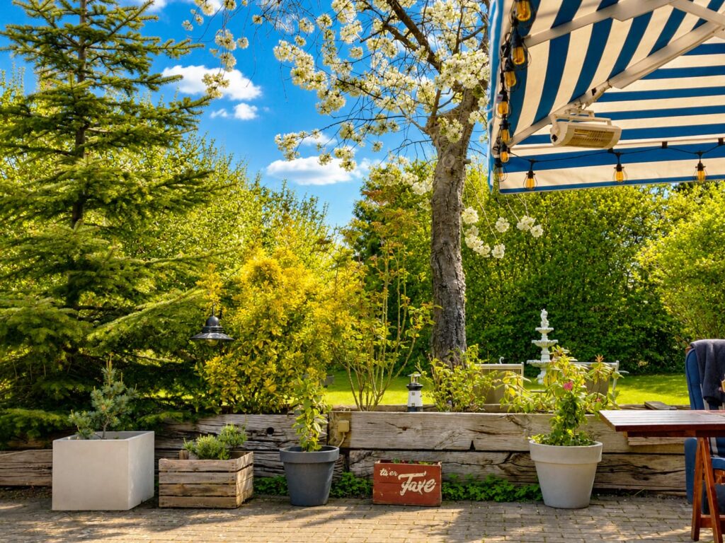 View across the private garden with mature apple and plum trees.