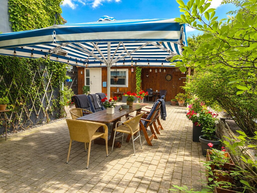 Covered seating area overlooking the private garden.