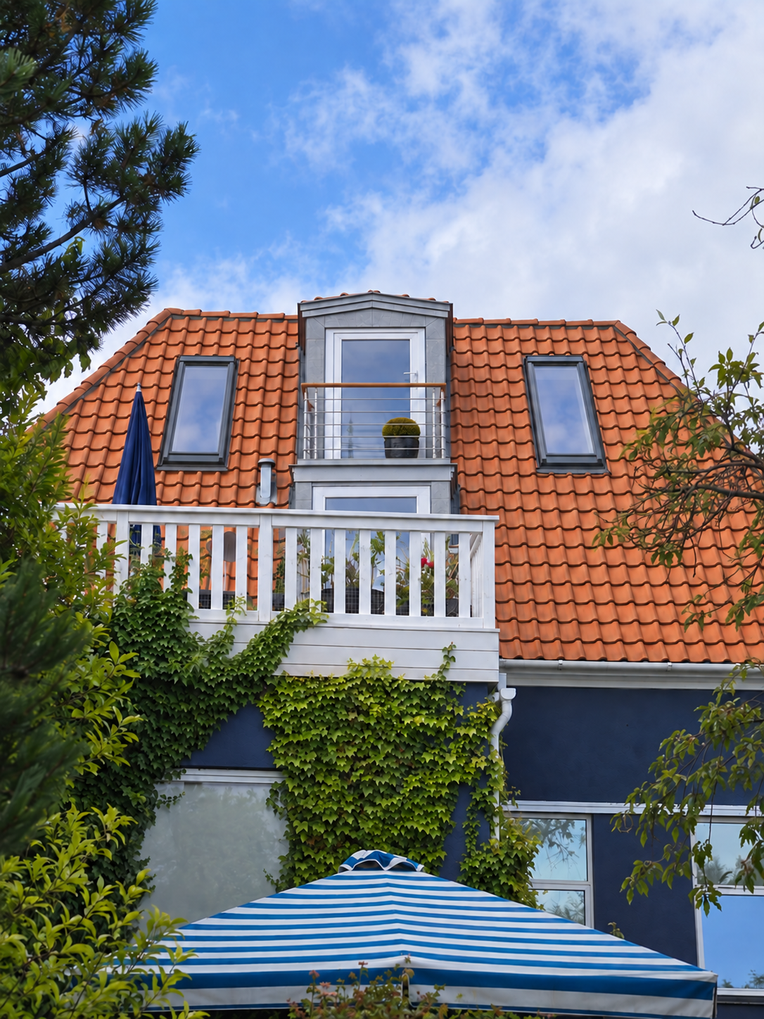 Possible future second floor at Blue House with a dormer, small balcony and two Velux roof windows facing the garden.